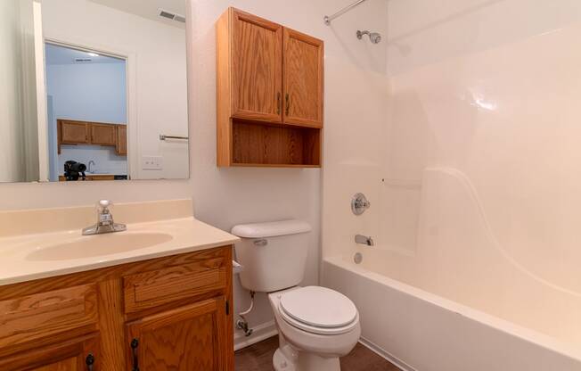 a bathroom with a sink toilet and a bath tub