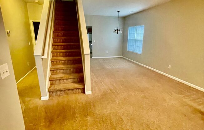 This two-story, 4-bedroom, 2-bath duplex in Fort Mill, SC sits on a corner lot