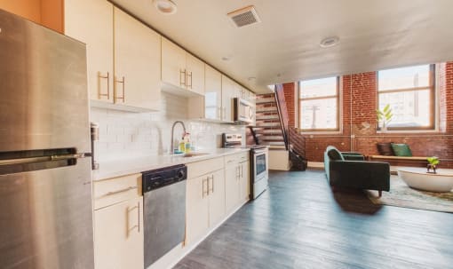 the kitchen is open to the living room and dining room