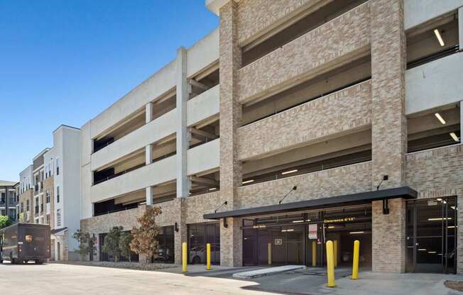 A parking garage with a clear blue sky in the background.