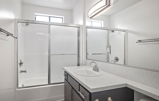 Modern styled bathroom with shower and tub.