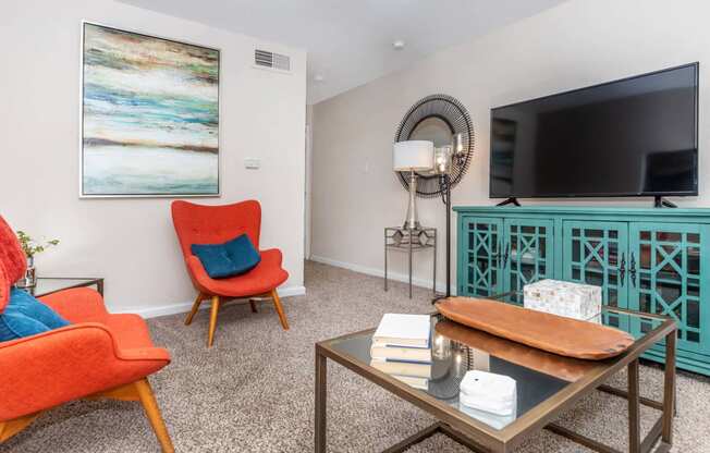 Living room with couch and tv at Royal Wildewood Manor Apartments, Clute, 77531