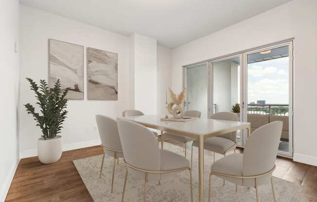 a dining room with a table and chairs