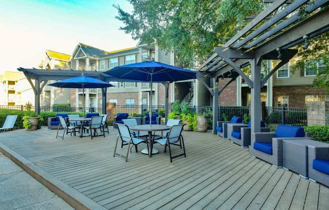 Sundeck with Tables, Chairs, and Cushioned Seatingat Polos at Hudson Corners Apartments, South Carolina 29650