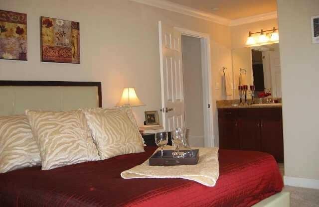 Beautiful upscale top floor 1 bedroom & 1 bath open concept condo - bright end unit with one reserved parking space. Amenities include: granite kitchen and bath, cherry wood cabinets, SS appliances, in unit washer & dryer, mirrored closet with custom cont