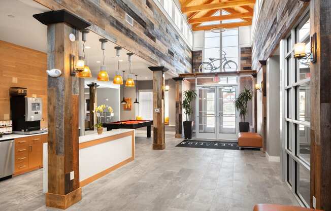 the lobby of an office building with a lobby area with a desk and a chair