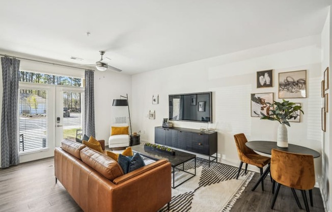 a living room with a couch and a table and a television