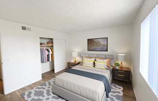 A bedroom with a large bed and a painting on the wall.