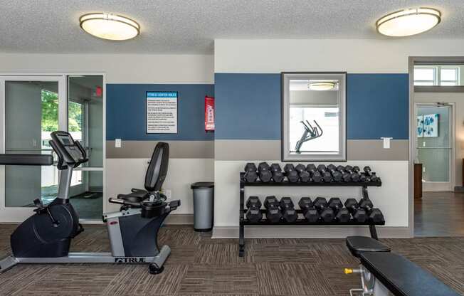 the fitness room at the village apartments