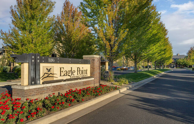 a sign for eagle point on the side of a road