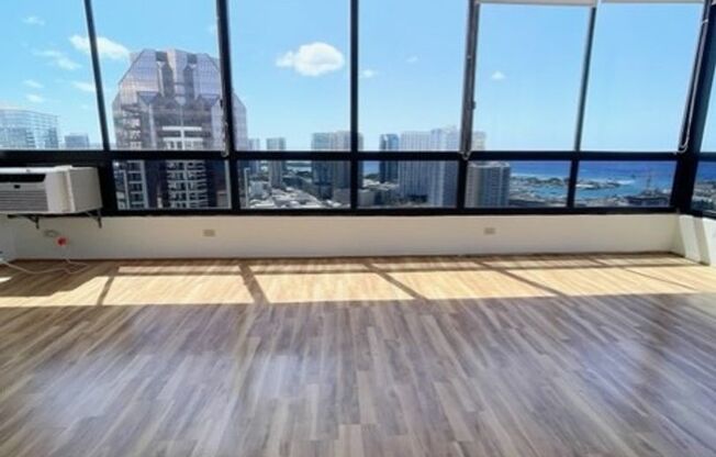 Rarely available corner end 2 bed 2 bath unit with 2 assigned parking stalls on high floor