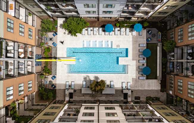 an aerial view of a swimming pool in the middle of a building