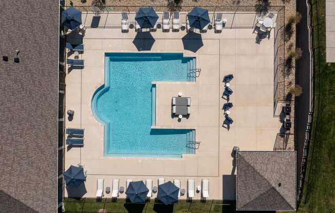 arial view of a swimming pool with tables and umbrellas  at Aventura at Hawk Ridge, Lake St Louis, Missouri