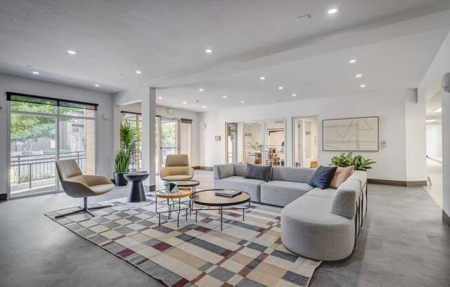 leasing lobby with couches and chairs and a rug