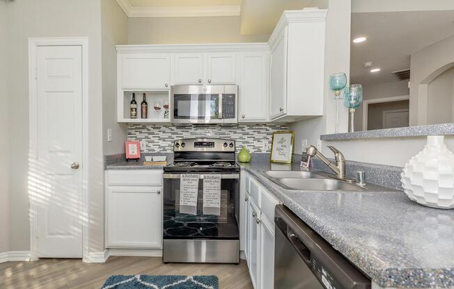 a kitchen with a stove and a sink