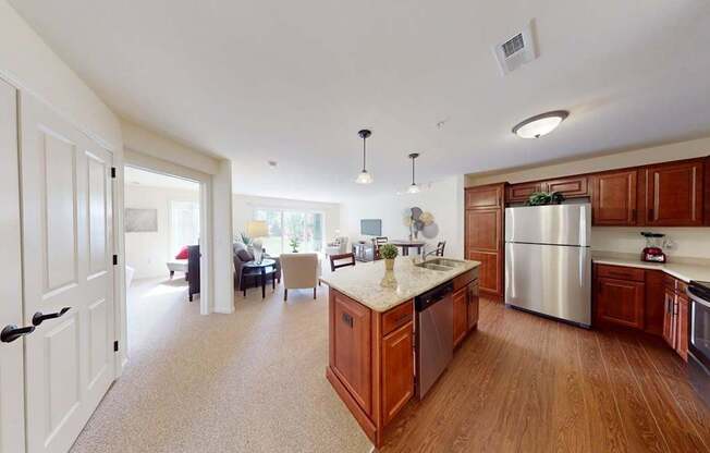 A kitchen with wooden cabinets and a stainless steel refrigerator.