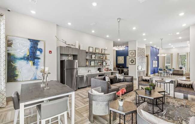 A modern living room with a grey sofa and a grey dining table.