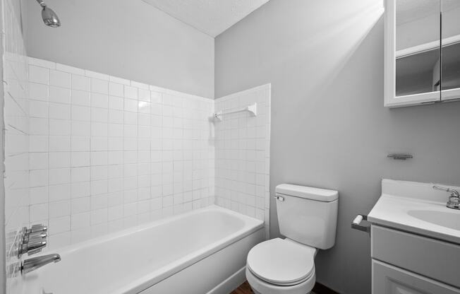 an empty bathroom with a toilet and a bath tub