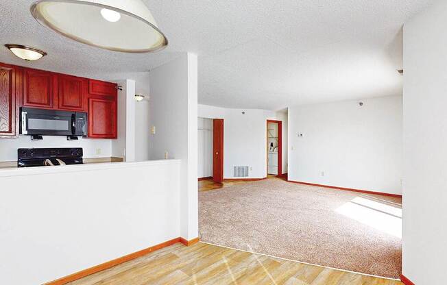 A living room with a television and a microwave.