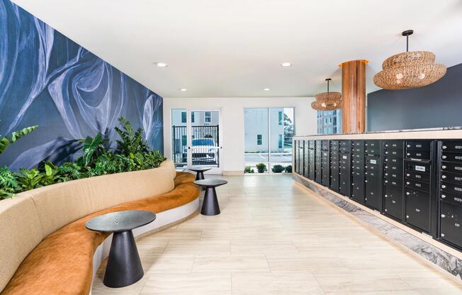 A welcoming mail lounge with bold textures, built-in seating, and a refined, modern finish.