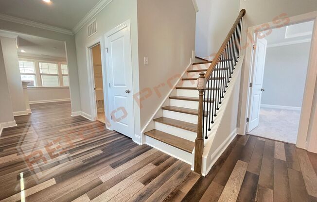 Beautiful 4 Bedroom 2.5 Bath Home with 2 Car Rear Entry Garage, First Floor Primary Bedroom Suite & Fireplace Plus Fiber Internet Included in Edge of Auburn Subdivision, Available June 6th!