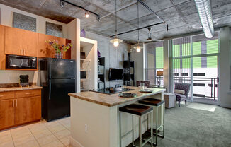 a kitchen with a center island and a stove top oven