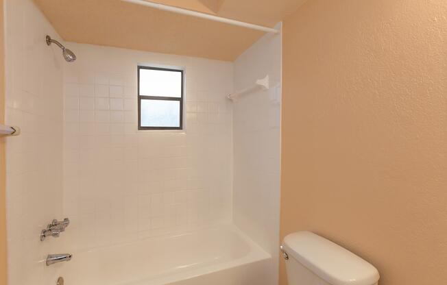 a small rest room with a sink and a shower