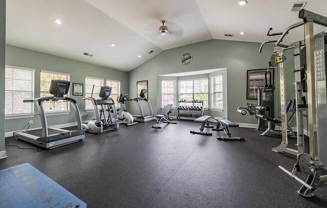 fitness center with treadmills and strength equipment