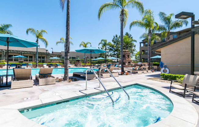 Rancho Bernardo Apartments-The Reserve at 4S Ranch-Sparkling Pool with Spa, Lounge Seating, and Umbrellas