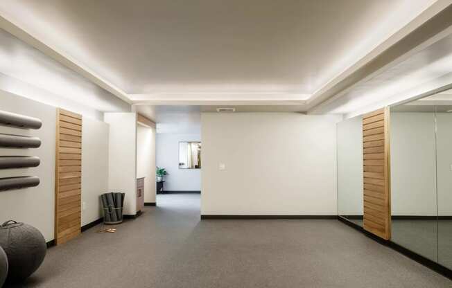 gym with mirrors and equipment at Slabtown Square Apartments, Oregon, 97209
