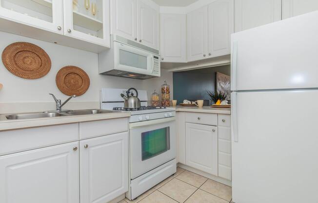 a stove top oven sitting inside of a kitchen
