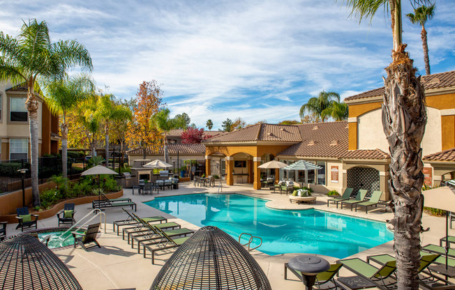 Relaxing resort-style pool with sundeck and spa 