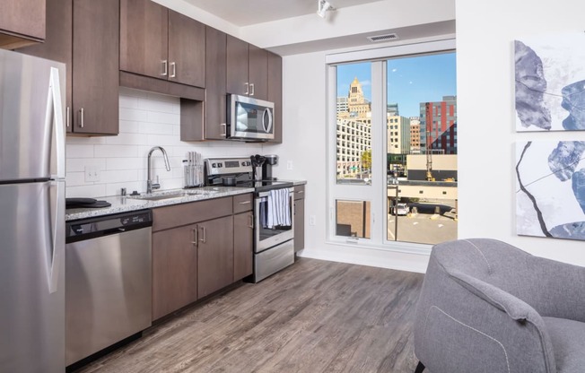 a kitchen with a view of the city and a window at Maven on Broadway, Minnesota, 55904