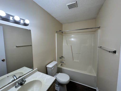 the preserve at ballantyne commons apartment bathroom with toilet sink and tub