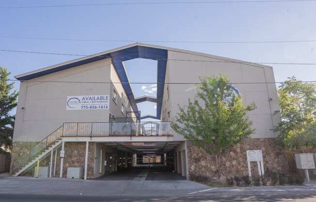 a large building with a bridge over a road