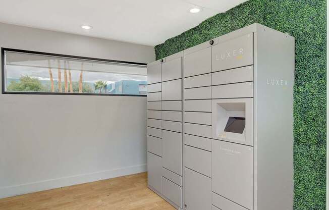 A row of LUXER branded storage units are lined up in a room.