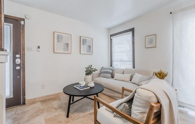 a living room with a couch and a table