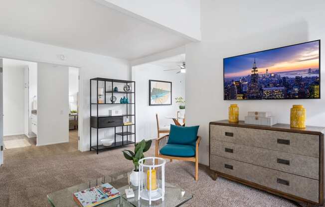 a living room with a couch and a table and a tv