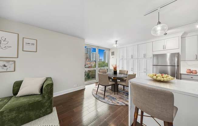 a living room with a kitchen and a dining room