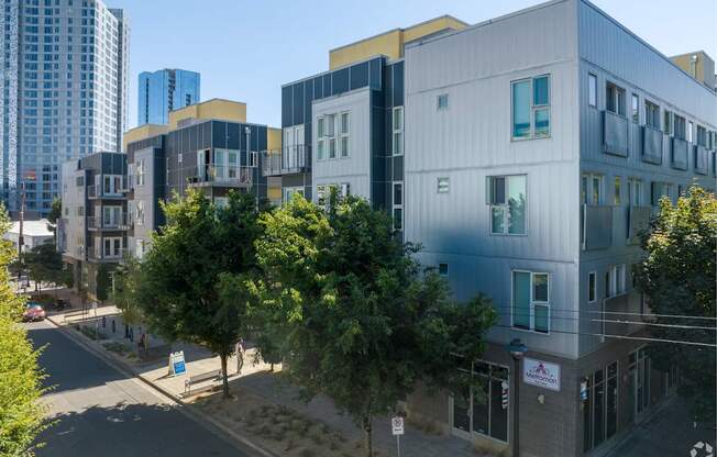 A street view of a residential area with modern buildings.