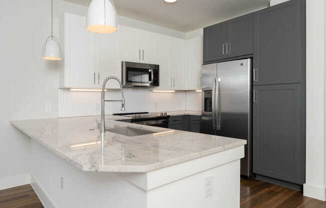 Kitchen with Stainless Steel Appliances and Quartz Countertops