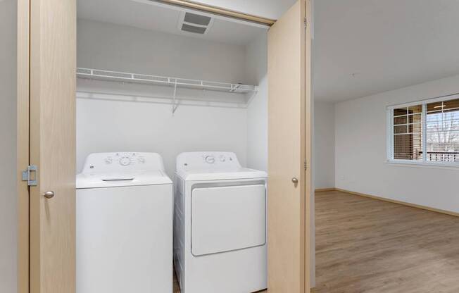 A laundry room with a washer and dryer.
