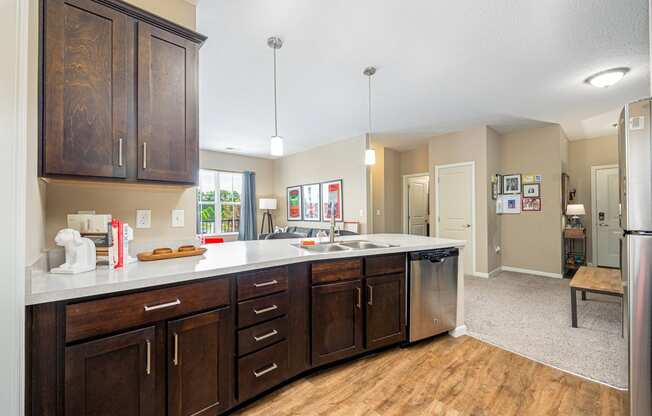 a kitchen with wooden cabinets and a white counter top