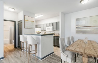 Parc at Metro Center Apartments in North Nashville, TN photo of a kitchen and dining room with a wooden table and chairs