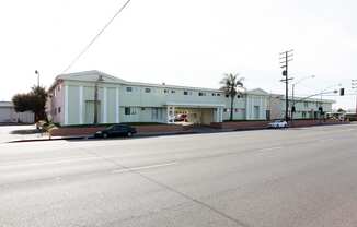 a large white building with a street in front of it at South Pointe Apts, Covina, 91722