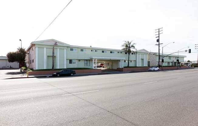 a large white building with a street in front of it at South Pointe Apts, Covina, 91722