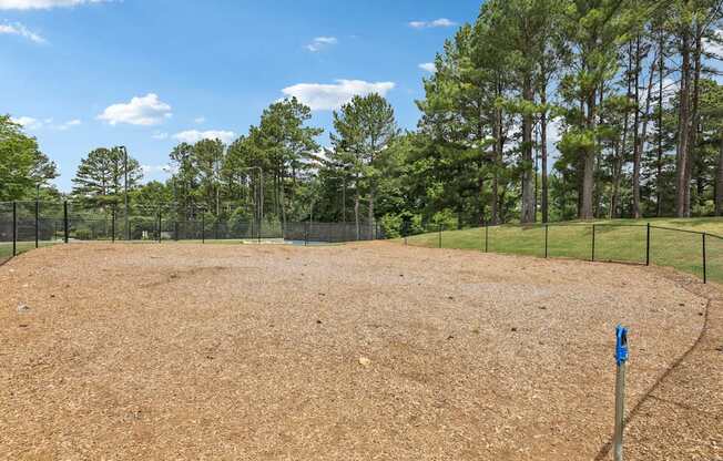 fenced in dog park. with water fountain