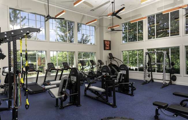 a room filled with lots of different types of exercise equipment