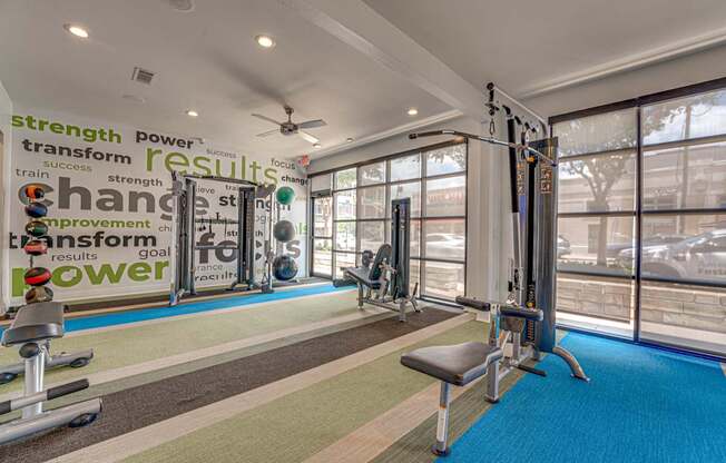 Fitness center with cable machines and equipment at Vue Live Oak Apartments, Dallas, TX 75204