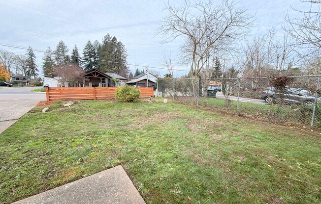 Comfortable Beaverton Home with AC, Fireplace, Large Fenced Yard, Spacious Garage and W/D!